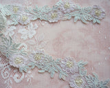 Embroidered trim with beads (5 motifs 45cm)