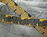 洋服の服飾品作り、カルトナージュ、キルト作品の装飾、バッグやポーチなど小物飾り、ハンドメイドの手芸に素敵に飾れそうなアンティックゴールドとブラックのばら柄のアメリカのテキスタイルのリボンです